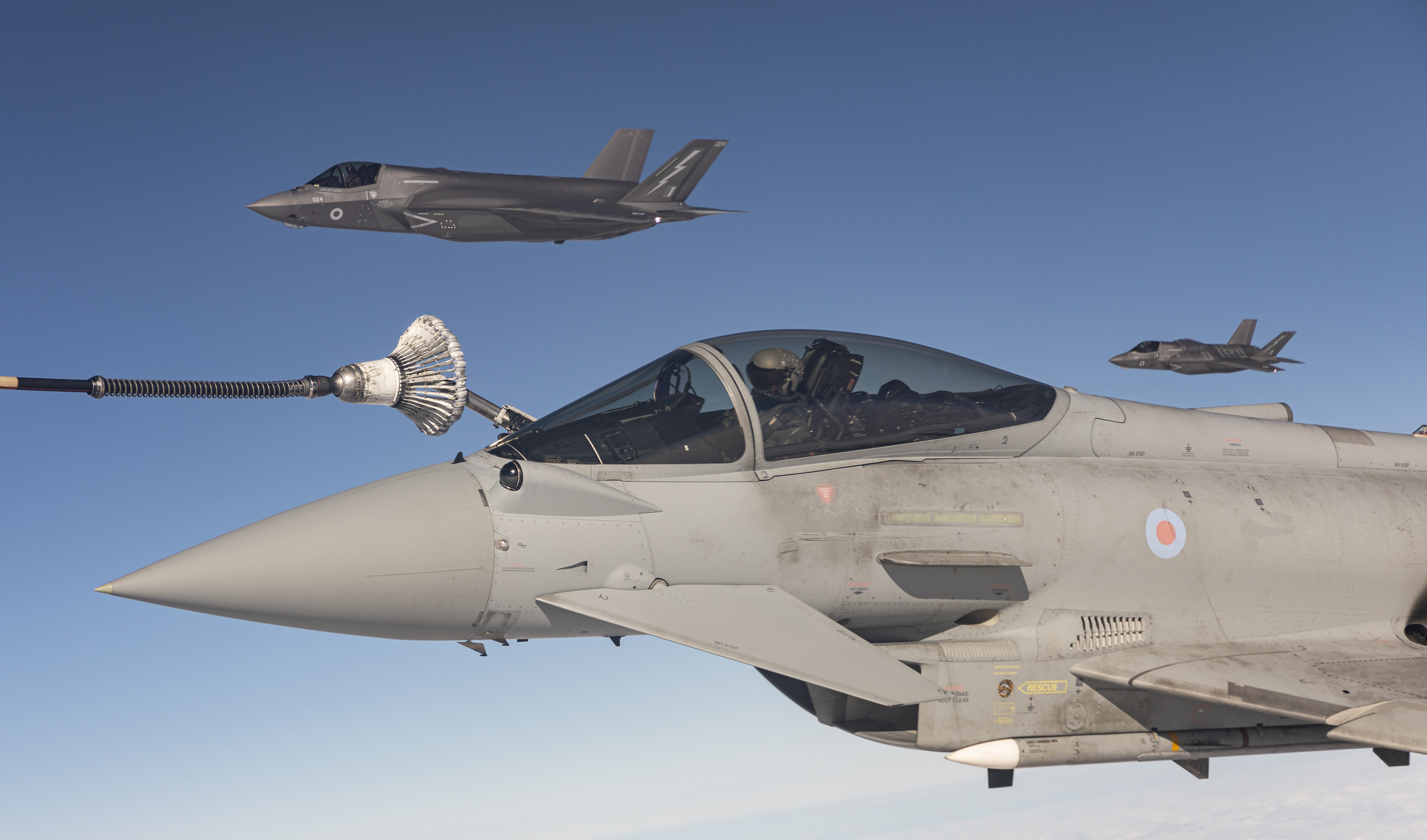 Fighter jets during air-to-air refuelling.